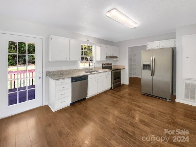 kitchen with white cabinets, dark hardwood / wood-style floors, sink, and appliances with stainless steel finishes