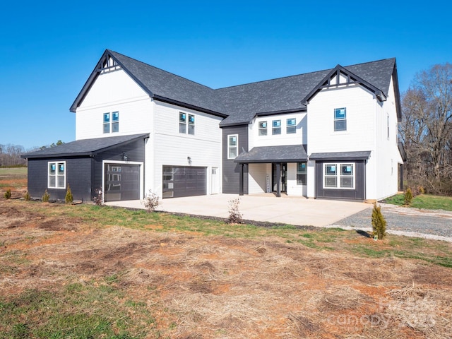 modern farmhouse style home with a garage