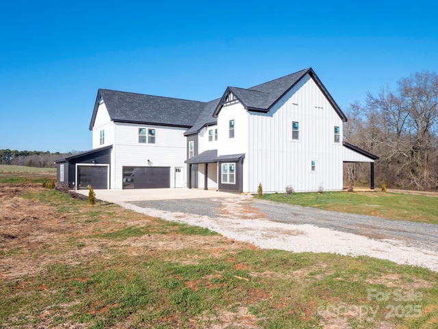 view of property exterior featuring a garage and a yard