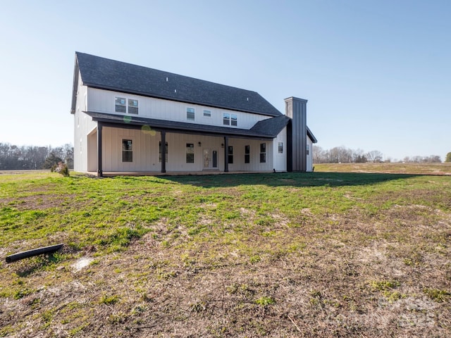 rear view of house with a lawn