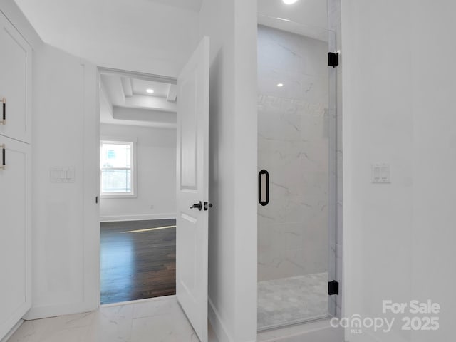 bathroom with a shower with shower door