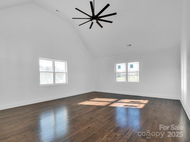 unfurnished living room featuring dark hardwood / wood-style floors, ceiling fan, and lofted ceiling