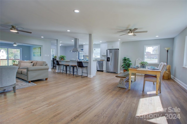 interior space featuring ceiling fan and light hardwood / wood-style flooring