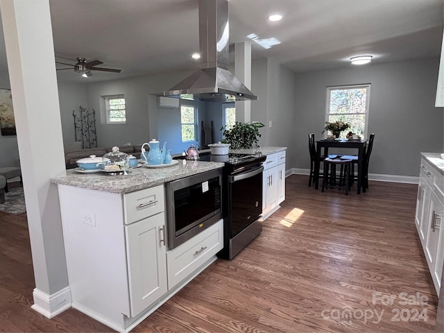 kitchen with electric range, dark hardwood / wood-style flooring, white cabinetry, and island exhaust hood