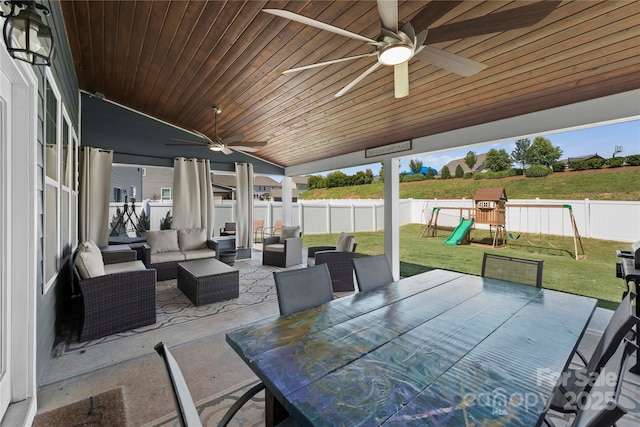 view of patio / terrace featuring ceiling fan, outdoor lounge area, and a playground