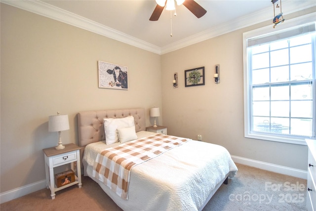 carpeted bedroom featuring ornamental molding and ceiling fan