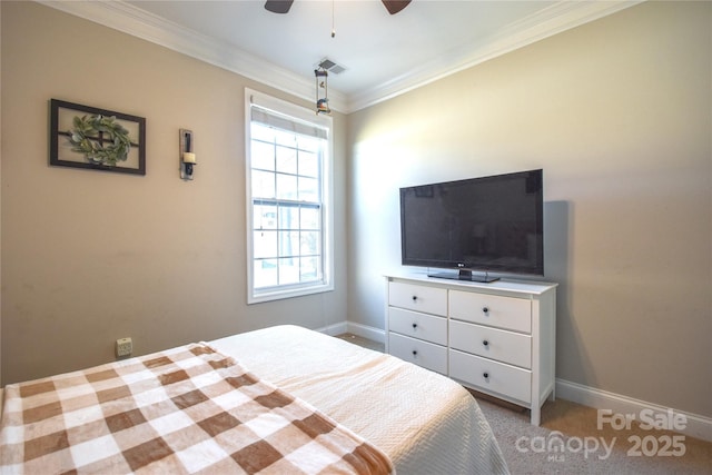 carpeted bedroom featuring crown molding and ceiling fan