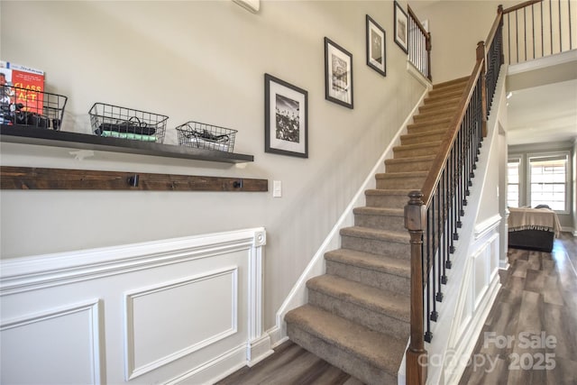 staircase with wood-type flooring