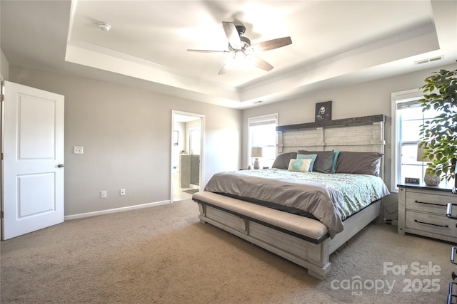 bedroom featuring crown molding and a raised ceiling