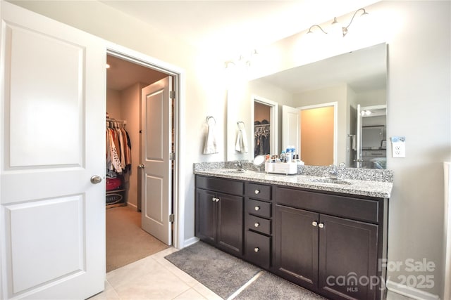 bathroom with vanity and tile patterned flooring