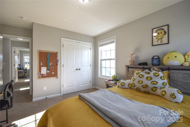 bedroom featuring a closet and carpet