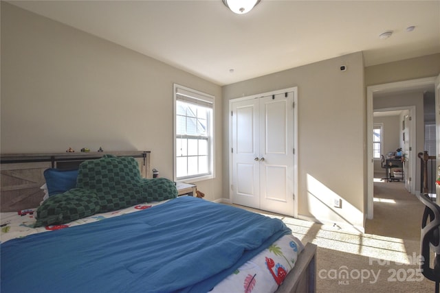 carpeted bedroom featuring a closet