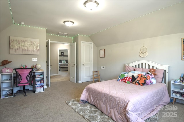 bedroom with vaulted ceiling and carpet