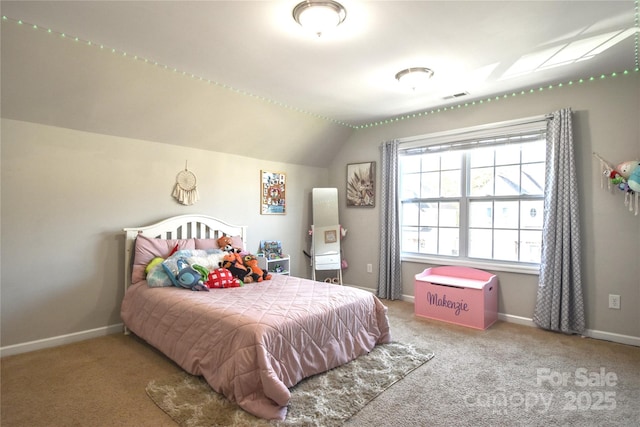 carpeted bedroom with vaulted ceiling