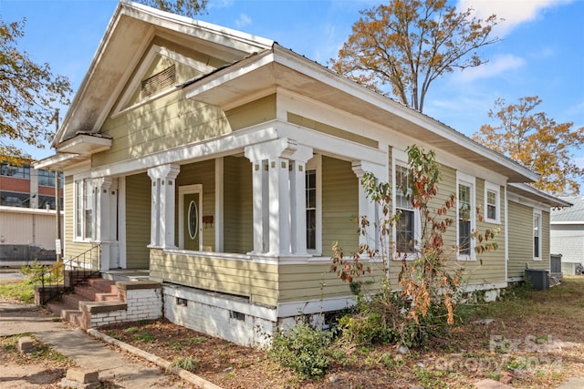 view of side of home featuring a porch