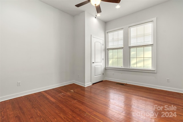 spare room featuring hardwood / wood-style flooring and ceiling fan