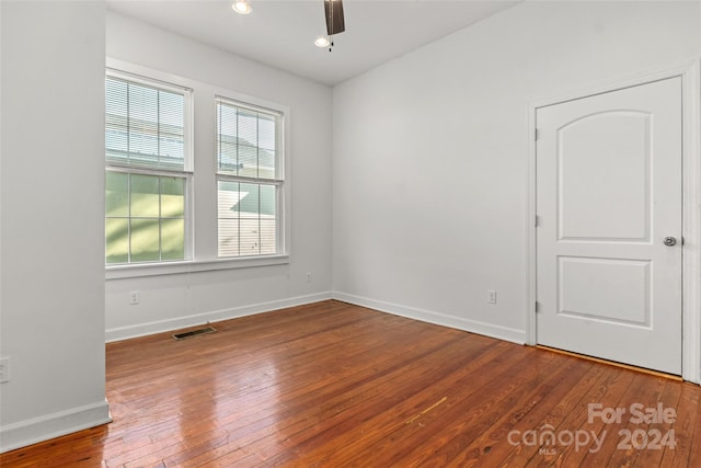 spare room featuring ceiling fan and wood-type flooring