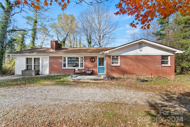 single story home featuring a patio area