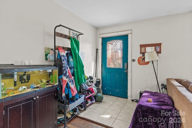 entrance foyer featuring light tile patterned flooring