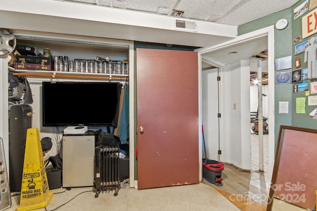 interior space featuring wood-type flooring and a closet