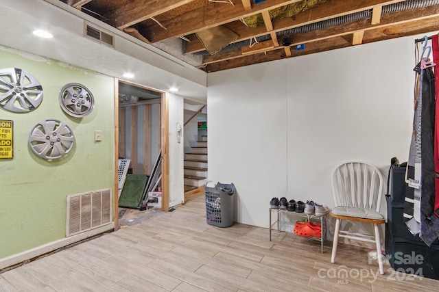 basement featuring light hardwood / wood-style floors