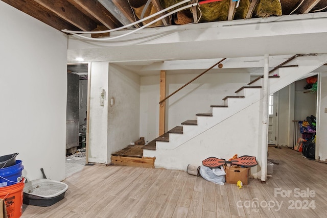 basement featuring hardwood / wood-style floors