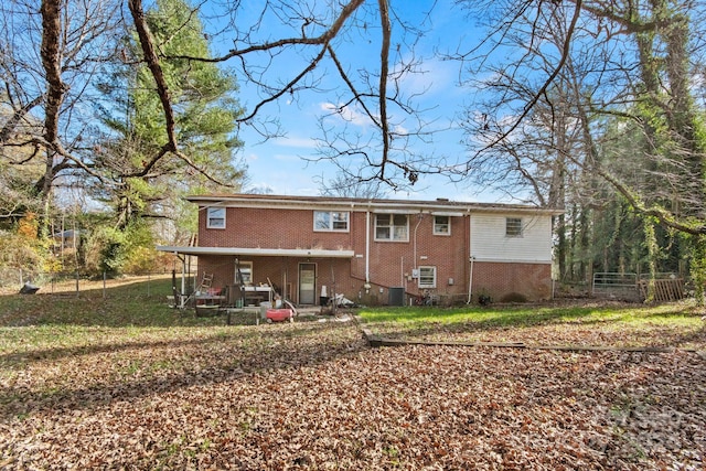 back of property featuring central air condition unit