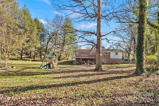 view of yard featuring a playground