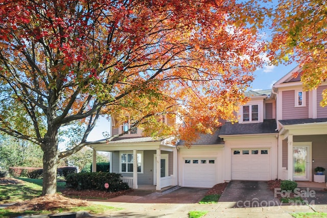 view of front facade featuring a porch and a garage