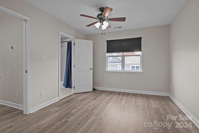 unfurnished bedroom featuring light hardwood / wood-style floors and ceiling fan