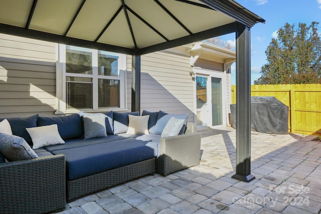 view of patio / terrace with outdoor lounge area, a gazebo, and a grill