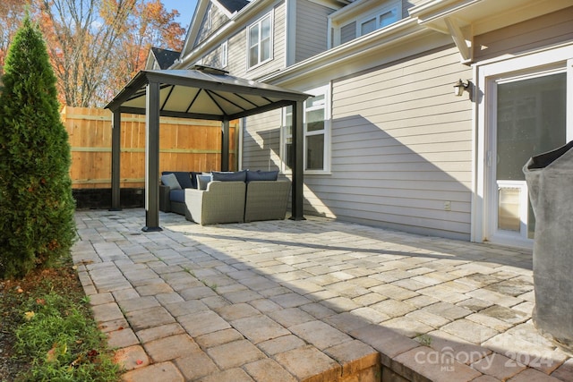 view of patio featuring a gazebo and outdoor lounge area