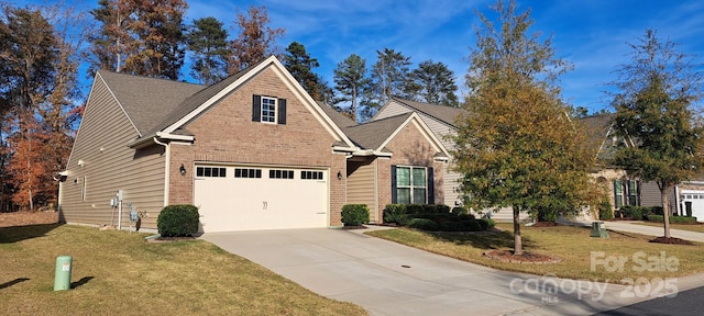 view of front of house featuring a garage and a front lawn