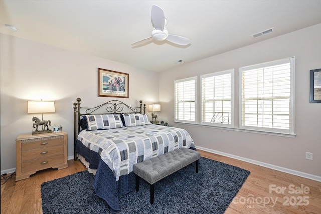 bedroom with ceiling fan and light wood-type flooring