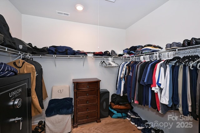 spacious closet featuring light wood-type flooring