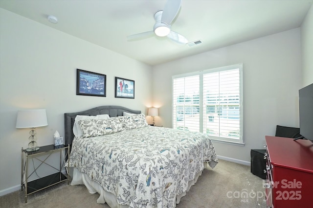 bedroom featuring light colored carpet and ceiling fan