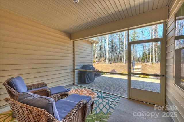 sunroom / solarium with wood ceiling and beam ceiling