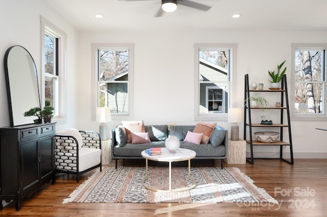 sitting room featuring dark hardwood / wood-style flooring and ceiling fan