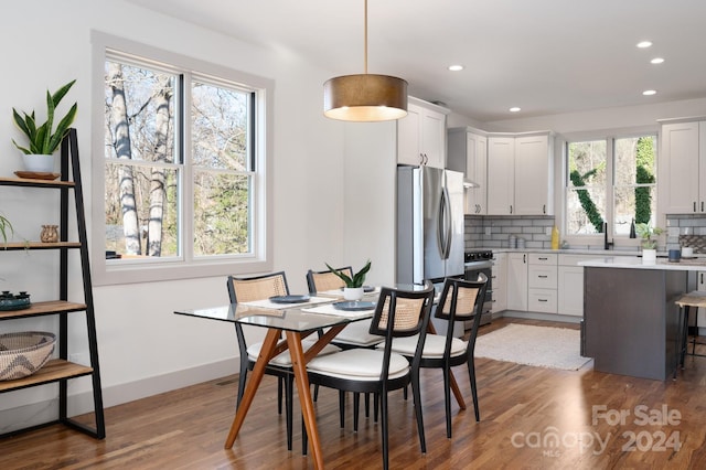 dining area featuring dark wood-type flooring