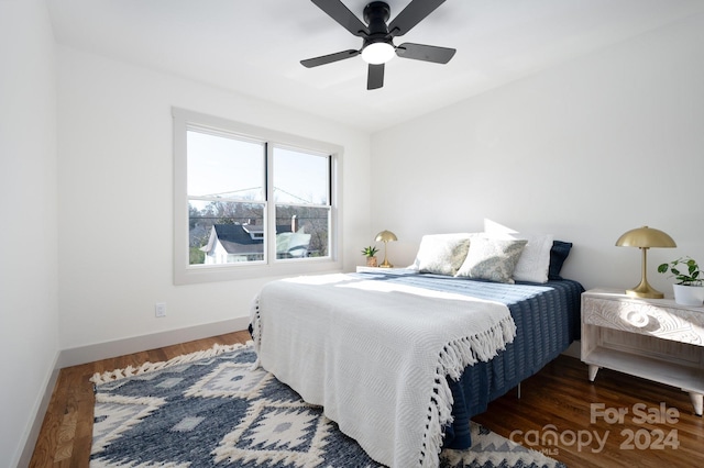 bedroom featuring dark hardwood / wood-style floors and ceiling fan