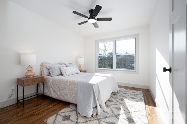 bedroom featuring dark hardwood / wood-style floors and ceiling fan