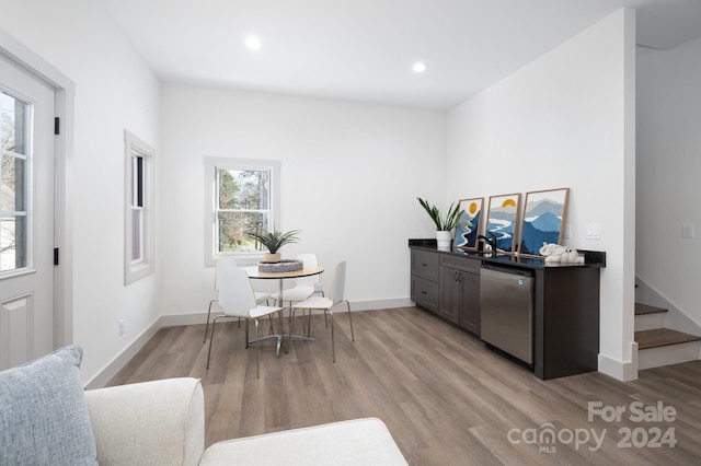 office area with sink and light wood-type flooring