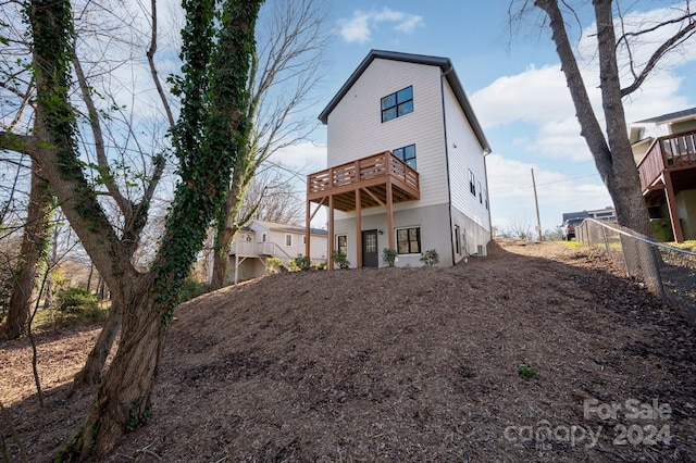 back of house with a balcony