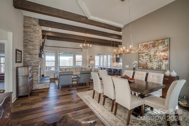 dining space with a notable chandelier, beam ceiling, and dark wood-type flooring