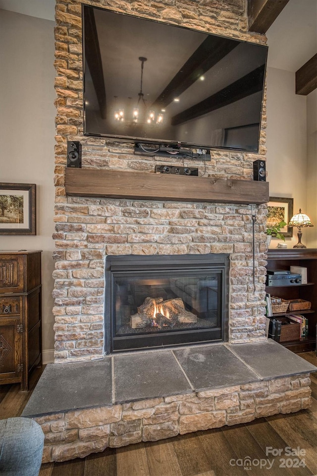 interior details featuring hardwood / wood-style flooring and a fireplace