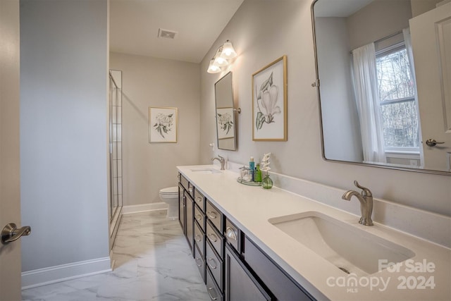 bathroom featuring vanity, toilet, and walk in shower