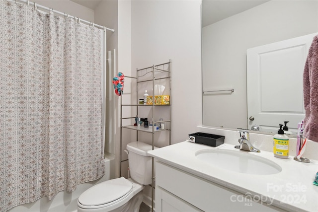 full bathroom featuring vanity, shower / bathtub combination with curtain, and toilet