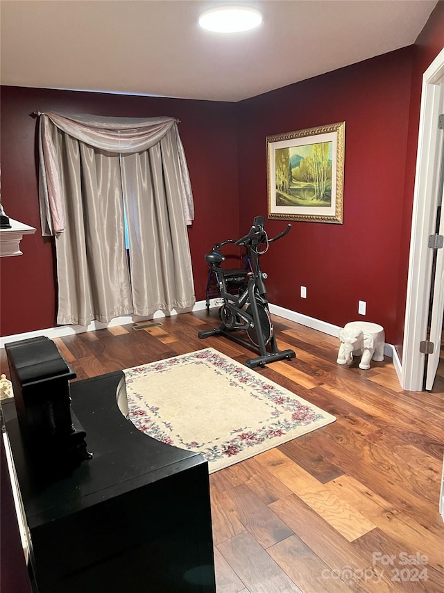 exercise area featuring hardwood / wood-style floors