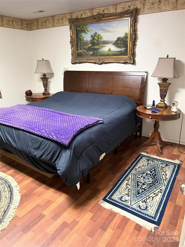 bedroom featuring hardwood / wood-style floors