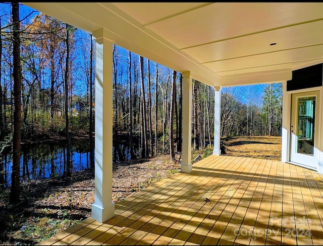 wooden deck with a water view